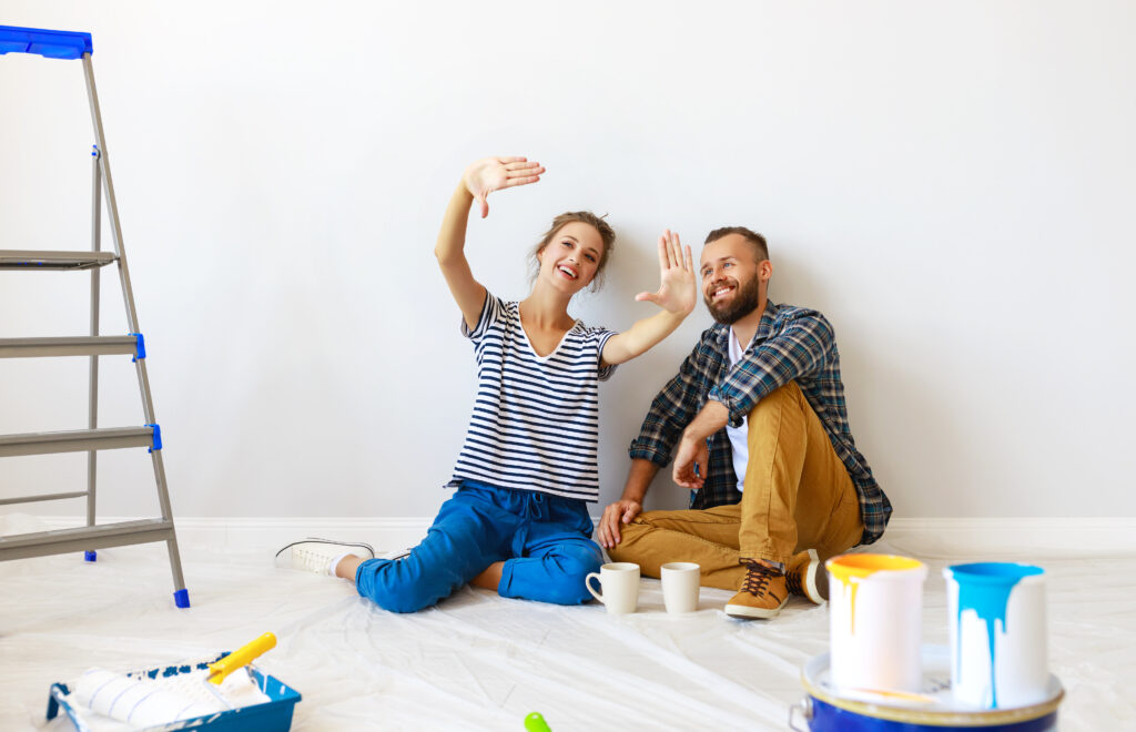Young,Happy,Family,Married,Couple,Dreams,Of,Renovating,House,And